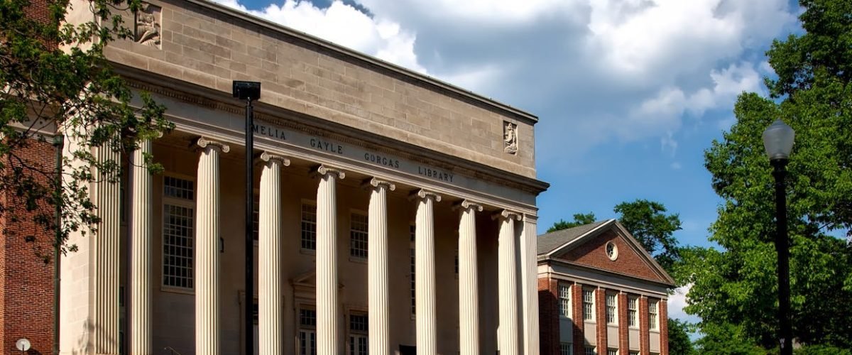 pexels-photo-256490-256490 Historic neoclassical university library with columns on a sunny day.